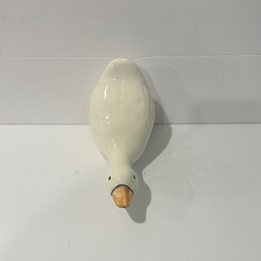 Elegant White Ceramic goose figurine.